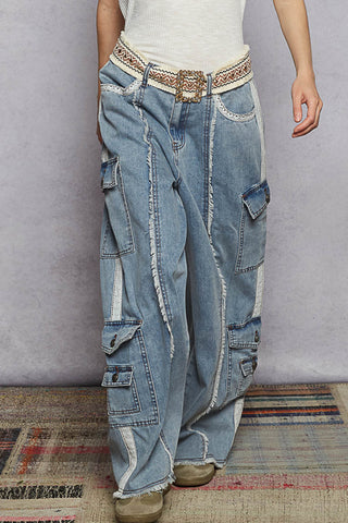 Light blue vintage wash jeans with fringe detailing at the front, offering a stylish and unique look.