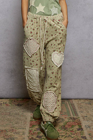 Sage green floral patchwork jogger with an elastic waistband and relaxed fit