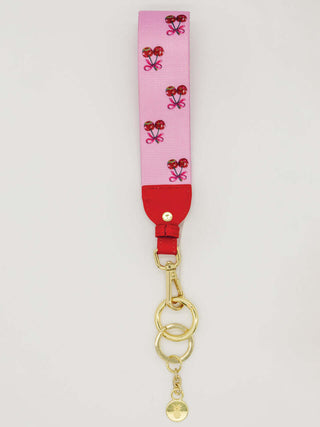 Simply Southern Key Fob in Pink Cherry Disco design, featuring vibrant cherries and a disco ball pattern on a durable strap.