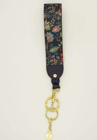 Navy floral Simply Southern key fob with colorful design and metal clasp, perfect for securing keys stylishly.