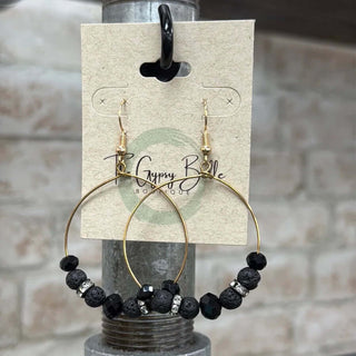 Elegant black beaded crystal circular gold hoop earrings showcasing intricate design and shimmering beauty for stylish accessorizing.