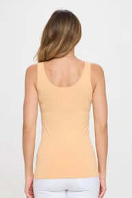 Women's PEACH buttery soft reversible seamless tank top, perfect for comfort and style, displayed on a hanger.