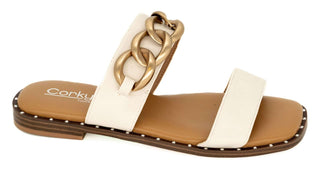 Corkys Catch Flights Not Feelings ivory slide sandal with gold chain detail, perfect for stylish summer outings.