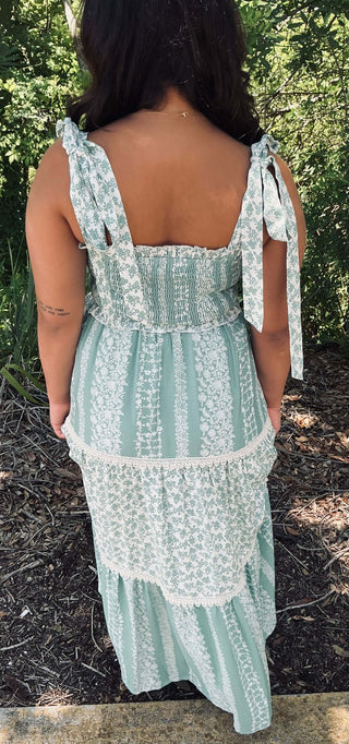 Listicle Maxi Dress in Sage Floral Smock with Tiered Ruffle Design Displayed on Mannequin