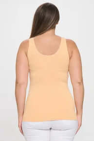 PEACH buttery soft reversible seamless tank top displayed on a hanger against a plain background, showcasing its smooth texture.
