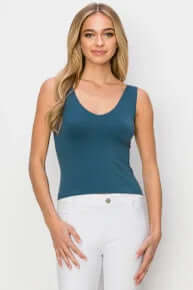 Model wearing a versatile Denim Buttery Soft Reversible Seamless Tank, showcasing comfortable and stylish design.