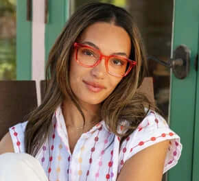 Bright red "Tiki Red Readers" glasses by Peepers featuring a bold, retro-inspired frame design on a clean, white background.