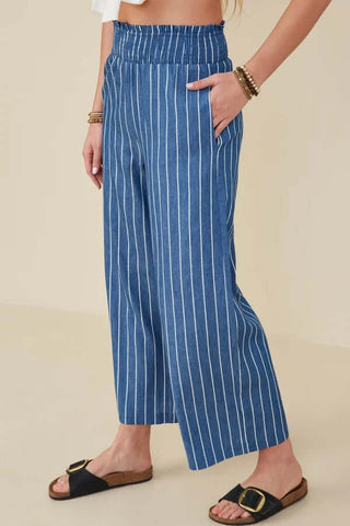 Dark chambray wide-leg pants with white stripe, featuring a comfortable smock waist, perfect for stylish casual wear.