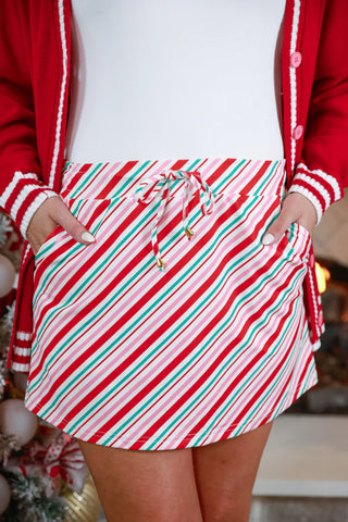 Pink, mint, and red candy cane skort with a playful design and flared silhouette