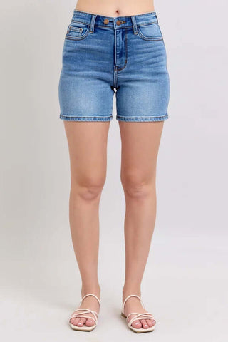 Judy Blue Med Wash Midi Length Classic Shorts with rolled hem, perfect for casual summer style.