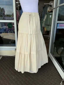 Elegant Natural Tiered Bow Side Maxi Skirt - Perfect for chic and sophisticated style, available now in flowing fabric.