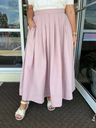 Dusty Mauve Elegant Pleated Midi Skirt with Pockets by Heyson displayed on a mannequin against a white background.