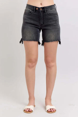 Alt text: "Judy Blue Black Cut Off Two Button Shorts with a stylish frayed hem, perfect for casual summer outfits.