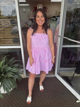 Elegant pink striped tie shoulder tiered dress, perfect for summer outings and casual gatherings.