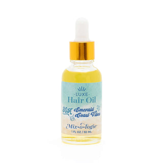 AMI Emerald Coast Mixologie Luxe Hair Oil: Luxurious hydration for radiant hair in a sleek, ocean-inspired bottle.