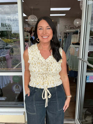 Smocked Ditsy Floral Ruffle Tie-Front Sleeveless Top in two colors, featuring a stylish and feminine design by &merci.