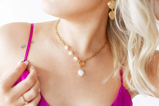 Elegant Freshwater Pearl Paperclip Chain Necklace by Lauren Kenzie, featuring a lifetime warranty, displayed on a chic jewelry stand.