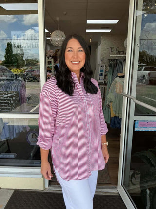 Stylish Stripe Oversize Button Down High Low Top in two colors for a chic and versatile look. Perfect for any casual occasion.