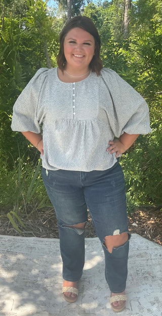 Navy and ivory ruched apron top with a stylish design and adjustable straps