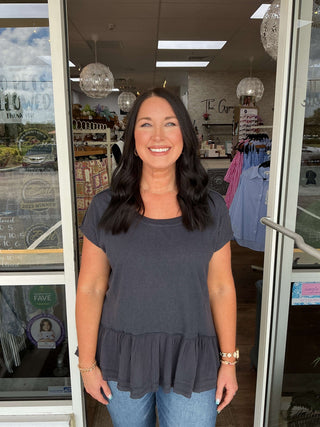 Soft Washed Ruffle Hem Wide Neck Top in two colors on hanger, showcasing relaxed fit and textured fabric detail.