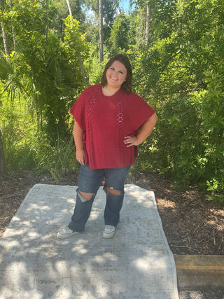 Light gray short sleeve poncho sweater with crochet accents and side ties