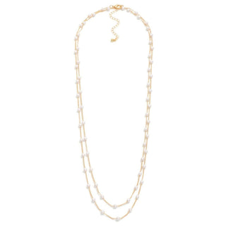 Elegant gold long chain necklace with lustrous pearl stations, enhancing your style with timeless sophistication.