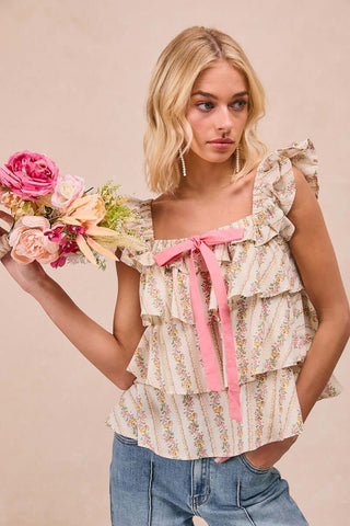 Ivory and pink floral print Bibi top with bow and ruffle square neck, perfect for a stylish and feminine look.