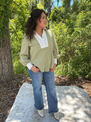 Olive green button-down top with a contrasting collar and long sleeves