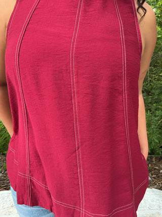 Light gray sleeveless tank top with contrast stitching, perfect for layering and casual wear