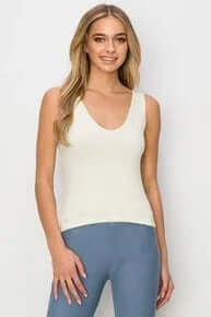 IVORY buttery soft reversible seamless tank top on hanger, showcasing its elegant design and quality fabric in natural lighting.