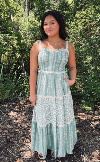 Sage floral smock-tiered ruffle maxi dress with balloon sleeves, displayed on a model against a neutral background.