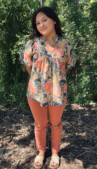 Umgee blue floral peasant top with puff sleeves, featuring a boho-chic design perfect for casual and stylish occasions.