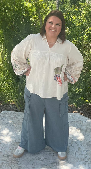 Light gray wide leg cargo pants made from soft French terry fabric with side pockets