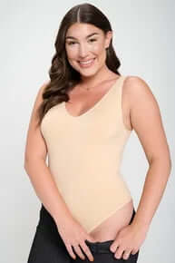 Alt text: "NUDE BODYSUIT Buttery Soft Seamless Tank on hanger, showcasing smooth fabric and elegant design.