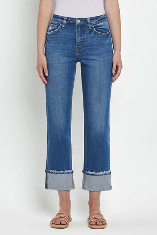Model wearing Lovervet T6600 High Rise Cuffed Straight Leg Jeans in light blue denim, paired with a white top and sneakers.