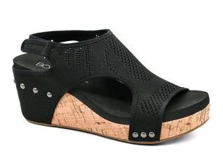 Alt text: "Corkys Black Knit Carley Wedge Shoe - Stylish, comfortable women's wedge with textured knit design and slip-on ease.