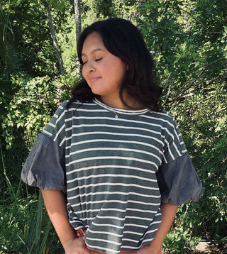 Women's striped textured top with contrast puff sleeves, available in two colors, perfect for adding style and elegance to any outfit.