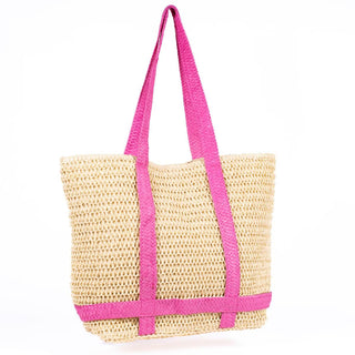 Hot pink beach tote with wide straps and a hat holder, perfect for stylish beach outings.