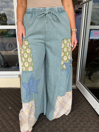 Washed denim patchwork wide-leg palazzo pants by Easel, featuring a stylish boho-chic design and comfortable fit.