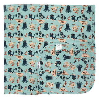Luxurious Pirates Life bamboo blanket with nautical design displayed in a cozy bedroom. Perfect for eco-friendly comfort.