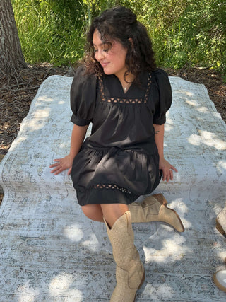 Black short sleeve dress with scallop accent trim and pockets