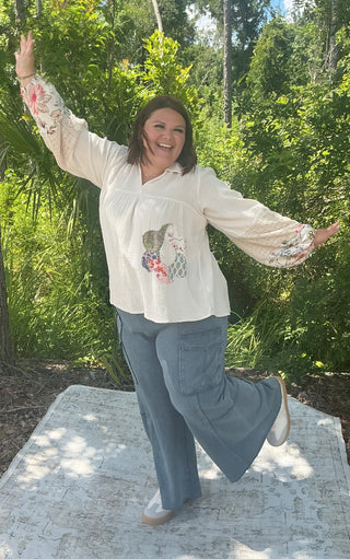 Light gray wide leg cargo pants made from soft French terry fabric with side pockets