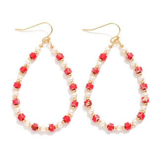 Elegant Red Pearl & Gold Bead Teardrop Earrings with intricate design, perfect for any occasion. Luxurious and eye-catching accessory.