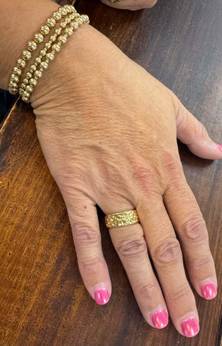 Hammered Adjustable Ring by Lauren Kenzie with Lifetime Warranty, showcasing a unique textured design on a neutral background.