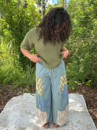 Light blue washed denim wide leg palazzo pants with a stylish patchwork design