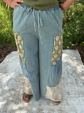 Light blue washed denim wide leg palazzo pants with patchwork detailing