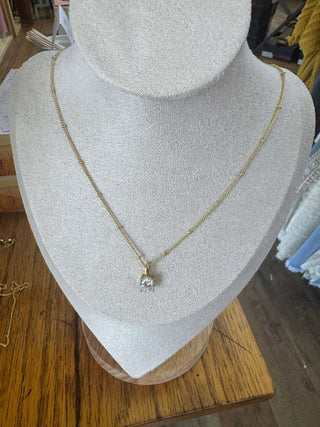 Gold BIRTHSTONE Necklace by Lauren Kenzie, featuring a vibrant gem, elegantly displayed on a white background; Lifetime Warranty included.