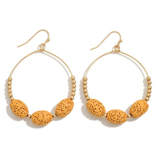 Chic mustard lava stone beaded drop earrings with gold accents, perfect for adding a trendy touch to any outfit.