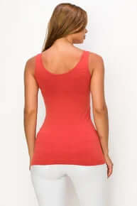 Burnt sienna buttery soft reversible seamless tank top, showcased on a hanger against a neutral background.