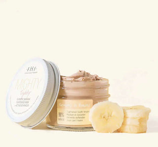 A jar of FHF Mighty Tighty® Turmeric & Banana Tightening Mask, a natural skincare solution for firm and youthful skin.